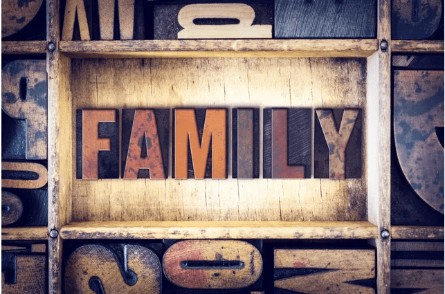 A wooden crate with the word family written in wood type.