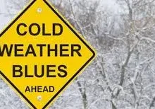 A yellow sign that says cold weather blues ahead.